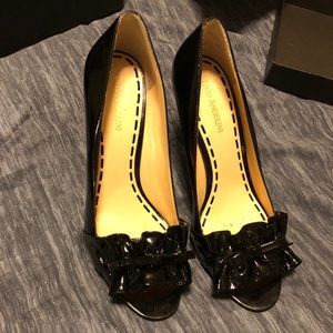 Enzo Angiolini black patent pumps